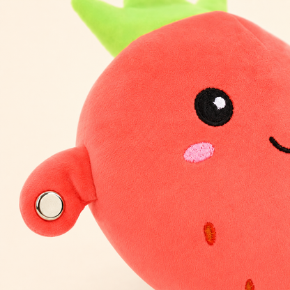 Close-up of the Strawberry Fruit Beat plush and circular touch sensor